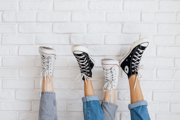 Various high-top sneakers showing different shoelace-tying styles, ideal for a lacing tutorial reference.
