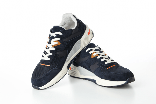 Dark blue athletic shoes featuring a unique lacing style, displayed against a clean white backdrop.